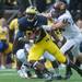 Michigan tight end Devin Funchess is tackled by Central Michigan's left end Blake Serpa during the first quarter of their game, Saturday, Aug, 31.
Courtney Sacco I AnnArbor.com  